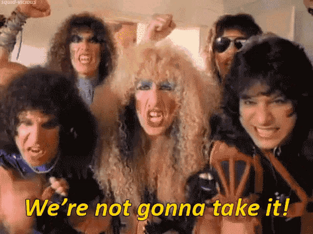 a group of people standing next to each other with the words we 're not gonna take it