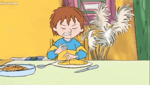 a cartoon of a boy sitting at a table with his arms crossed and a plate of food in front of him