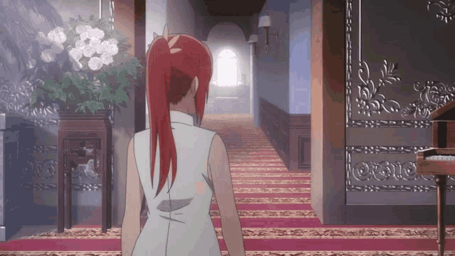 a woman with red hair is standing in a hallway next to a piano