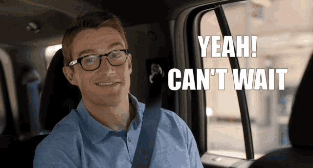 a man sitting in the back seat of a car says yeah can t wait