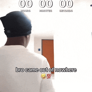 a man standing in front of a wall that says 00 hours minutes seconds and bro came out of nowhere