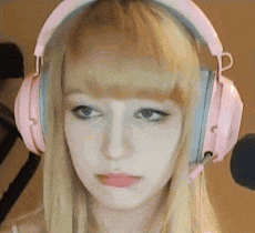 a woman wearing pink headphones and a microphone .