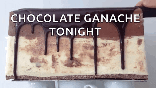 a piece of chocolate ganache tonight cake with chocolate dripping down the sides