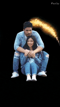 a man is sitting on a woman 's lap with a flexclip logo in the background