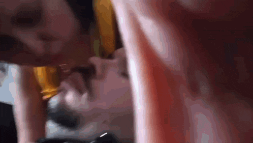 a close up of a person 's face and arm
