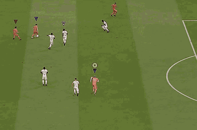a soccer player is kicking a ball into a goal .