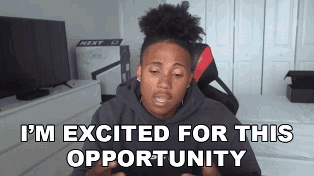 a woman says i 'm excited for this opportunity while sitting in a chair