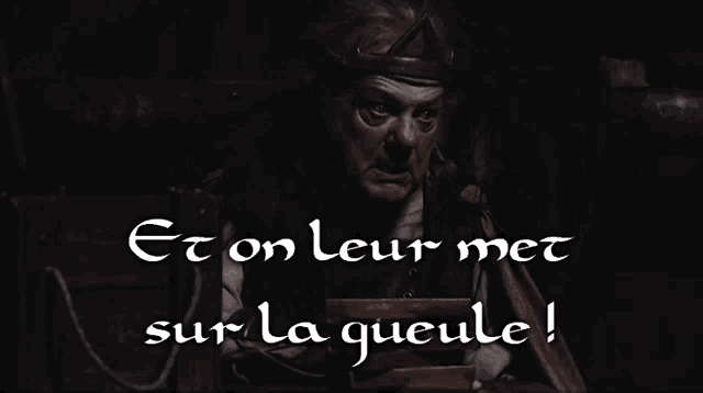 a man with a crown on his head and the words et on leur met sur la queue