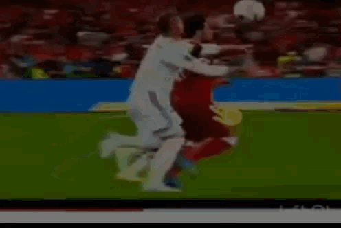 a blurry picture of a soccer game with a ps4 advertisement in the background
