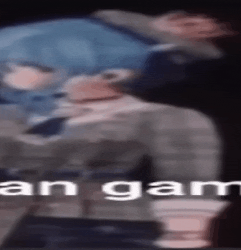 a blurry picture of a person with the words ' an gan ' on the bottom .