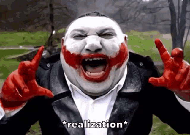 a man in a joker costume is making a funny face and says " realization "