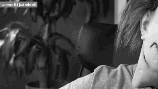 a black and white photo of a person with a caption that says cameron485 just subbed