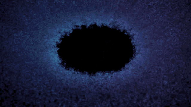 a blue circle with a black hole in the middle of it