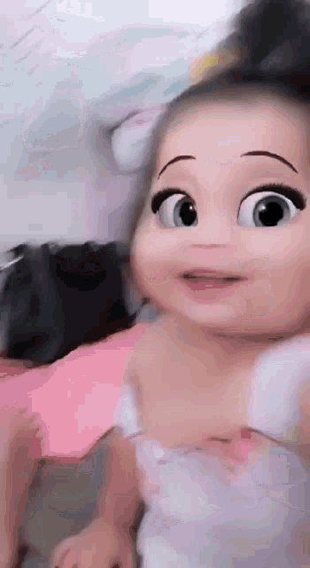 a baby with a cartoon face on her face .