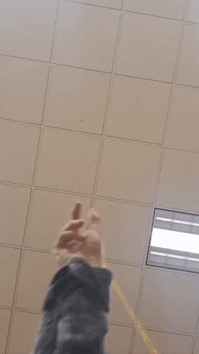 a person making a heart shape with their fingers