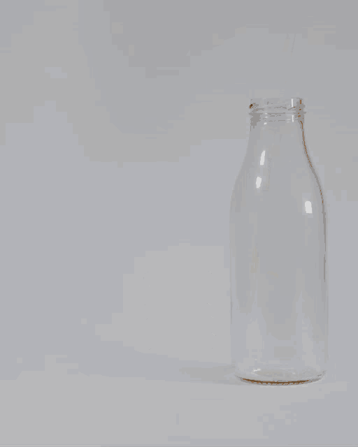 a stack of cookies next to a bottle of milk with the words merry christmas