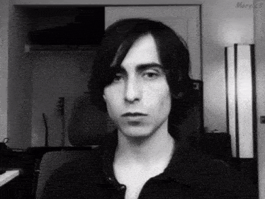 a black and white photo of a man with the name mary on the bottom left