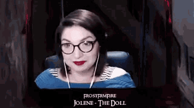 a woman wearing glasses and headphones is sitting in front of a screen that says " jolene the doll "