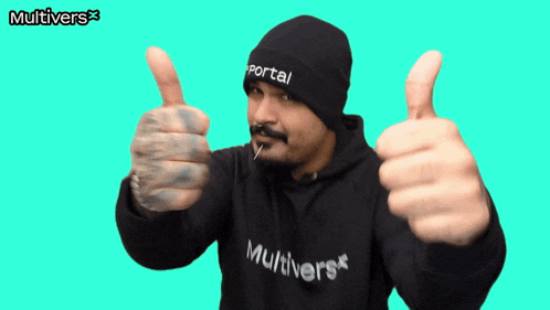 a man giving a thumbs up wearing a black multiverse hoodie