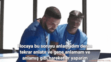 two men are looking at a laptop with a caption that says hocaya bu soruyu anlamadım