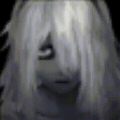 a pixelated image of a woman 's face with a ghostly look on her face