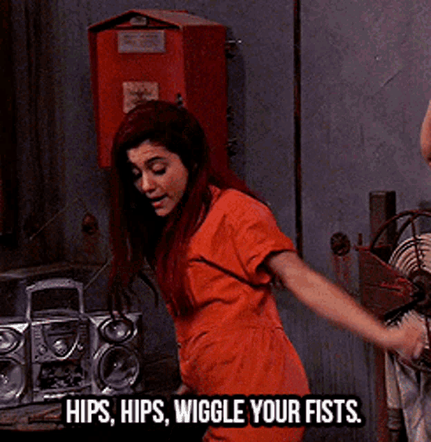 a woman in a jail cell is dancing with the words hips hips wiggle your fists below her