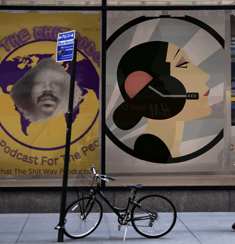 a bicycle is parked on the sidewalk in front of a sign that says " podcast for the people "