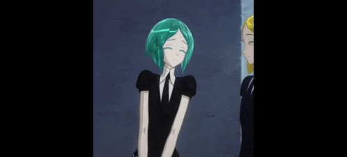 a girl with green hair is standing next to another girl in a black dress .