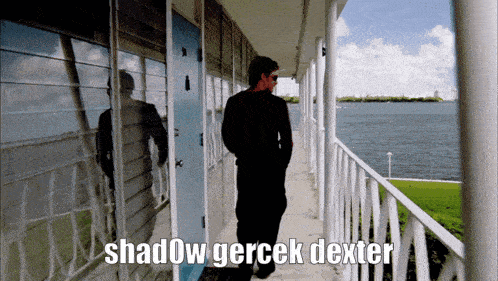 a man is walking down a hallway with the words shadow gerçek dexter written on the bottom