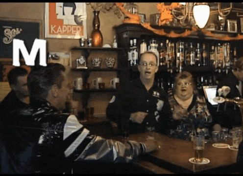 a group of people in a bar with a sign that says kapper on it