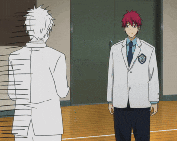 a man with red hair is standing next to another man