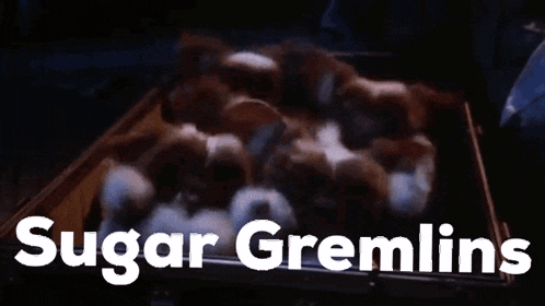 a bunch of gremlins are laying in a box with the words sugar gremlins above them
