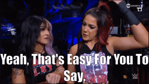two women standing next to each other with the words yeah that 's easy for you to say on the bottom
