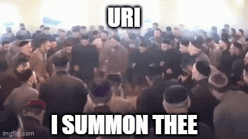 a large group of people are gathered in a room and dancing .