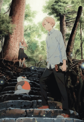 a boy and a girl standing on a set of stairs