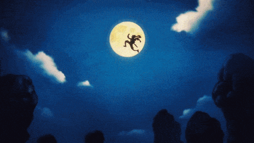 a silhouette of a monkey is flying in the night sky above a full moon