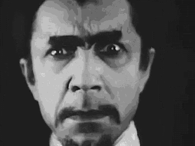 a close up of a man 's face with a mustache and eyebrows painted black .