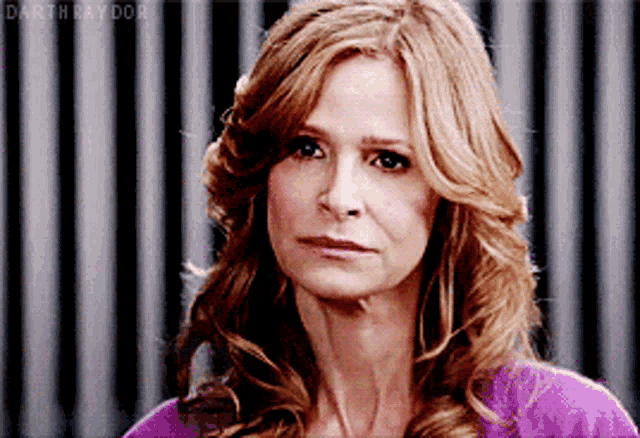 a close up of a woman 's face with the name darth raydor on the bottom