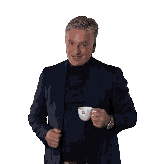 a man in a suit is holding a cup of coffee from illy