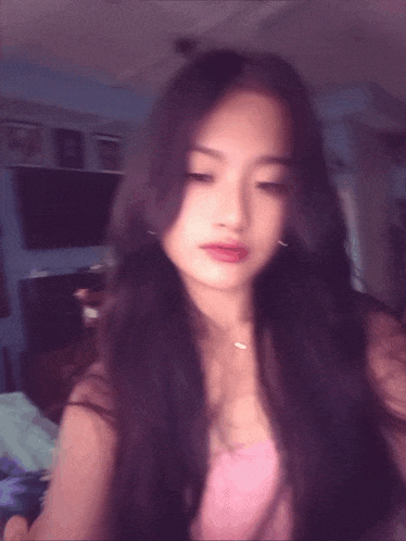 a blurry photo of a woman with long hair