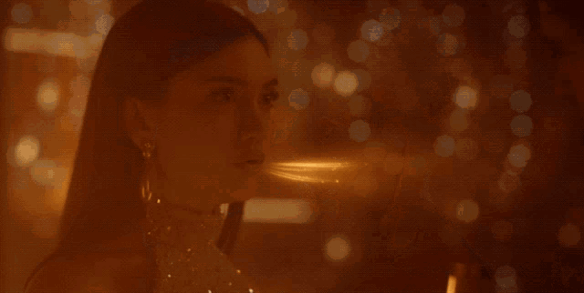 a man and woman are looking at each other and the man has a light coming out of his mouth