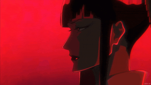 a close up of a woman 's face in a red background
