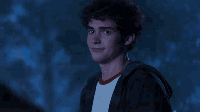 a blurry picture of a man 's face in a dark room .