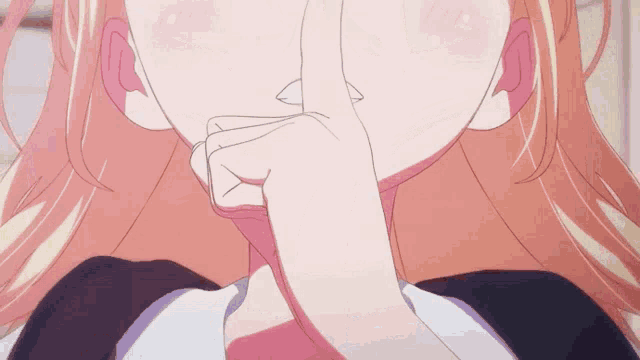 a girl with blonde hair is covering her mouth with her hand