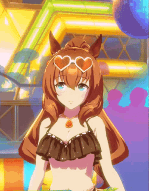 a girl in a bikini with heart shaped sunglasses