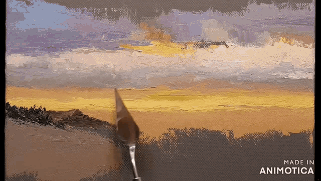a painting of a sunset is being painted by a person