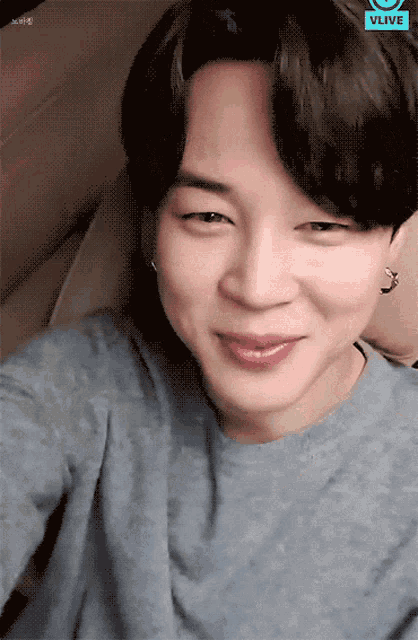 a close up of a person 's face with the words vlive on the bottom right