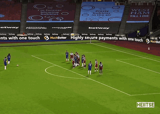 a soccer field with a banner that says highly secure payments with one touch on it