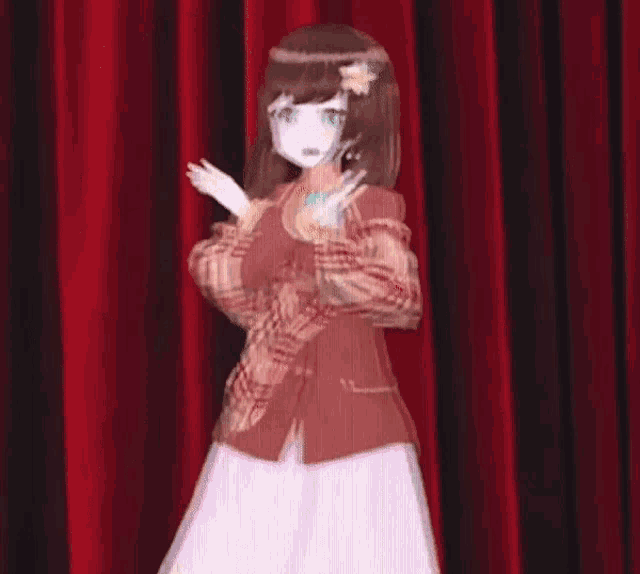 a girl in a plaid jacket is standing in front of a red curtain on a stage .