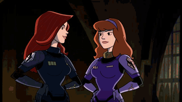 scooby doo and daphne are standing next to each other in a dark room
